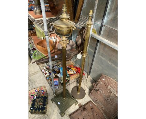A VINTAGE HEAVY BRASS STANDARD LAMP WITH STEPPED BASE AND A FURTHER VINTAGE BRASS STANDARD LAMP WITH LION PAW FEET