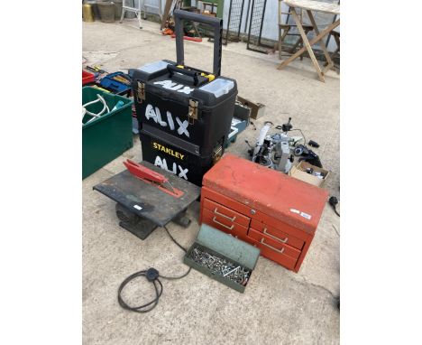 AN ASSORTMENT OF TOOLS TO INCLUDE A STANLEY TWO WHEEL TOOL BOX, NUTS AND BOLTS AND A RED METAL TOOL CHEST ETC