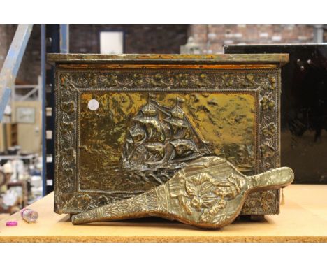 AN ANTIQUE BRASS COAL/LOG STORAGE BOX DEPICTING SHIPS TOGETHER WITH A BRASS AND WOOD FIRE BELLOW