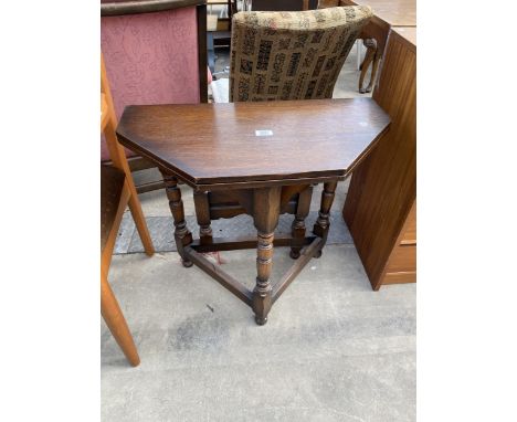 A MINIATURE OAK GATE-LEG TABLE WITH CANTED CORNERS ON TURNED LEGS