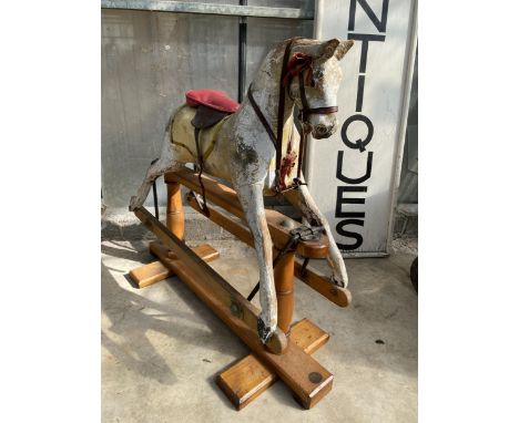 A VINTAGE WOODEN CHILDS ROCKING HORSE
