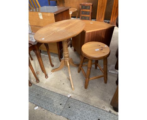 AN OVAL PINE TRIPOD TABLE AND KITCHEN STOOL