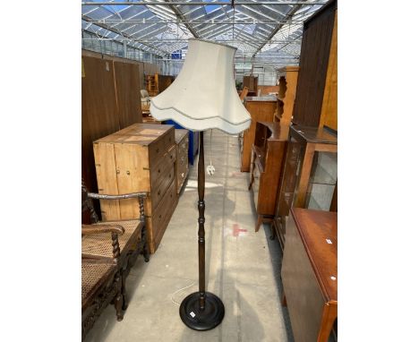 A BEECH STANDARD LAMP WITH TURNED COLUMN AND SHADE