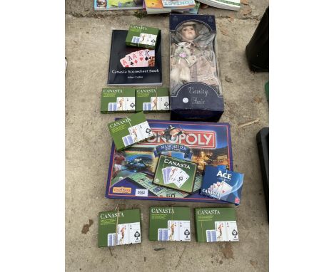 A VANITY FAIR DOLL, MONOPOLY AND NINE CANASTA PLAYING CARD PACLS AND SCORESHEET BOOK