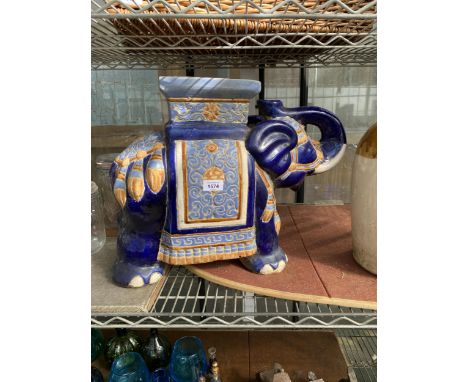 A LARGE BLUE CERAMIC ELEPHANT JARDINAIRE STAND