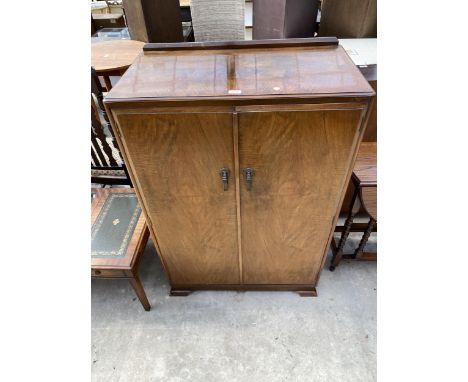 A WALNUT ART DECO TWO DOOR WARDROBE, 33" WIDE