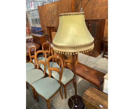 A STANDARD LAMP WITH TURNED COLUMN AND SHADE