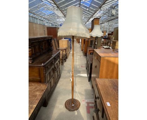 A BEECH STANDARD LAMP WITH TURNED COLUMN AND SHADE