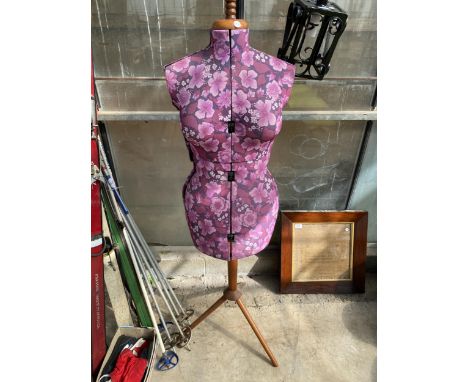 AN ADJUSTABLE DRESS MAKERS MANEQUIN ON TRIPOD BASE
