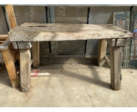 A LARGE VINTAGE WOODEN BUTCHERS BLOCK