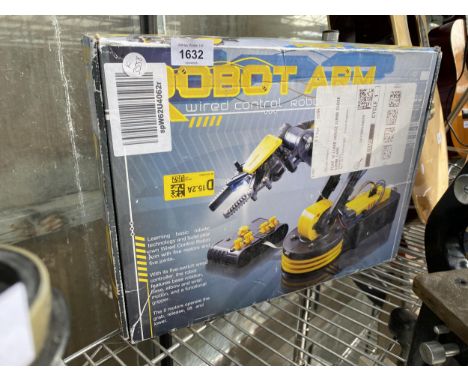 A BOXED ROBOT ARM WITH WIRED CONTROLLER