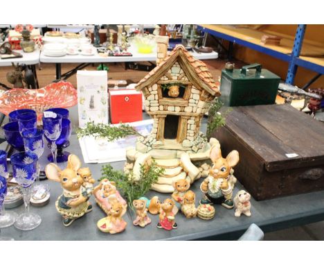A COLLECTION OF PENDELFIN TO INCLUDE A LARGE DISPLAY HOUSE, TWO LARGE RABBITS, FIVE SMALLER RABBITS, THREE DOGS AND A BASKET 
