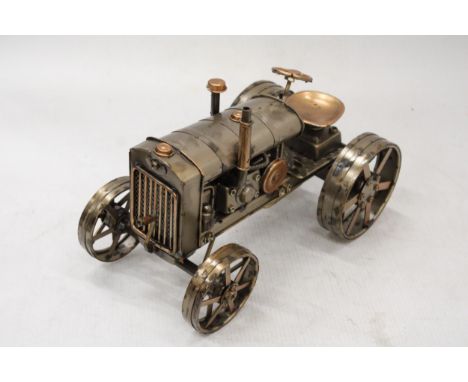 A TIN PLARE MODEL OF A TRACTOR, LENGTH 25CM