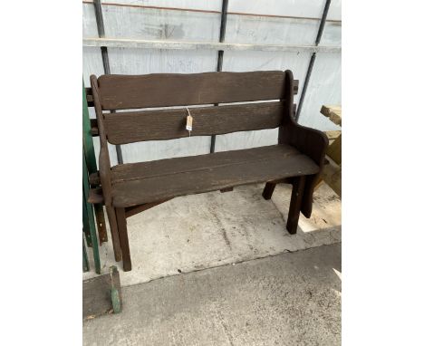 A WOODEN GARDEN BENCH