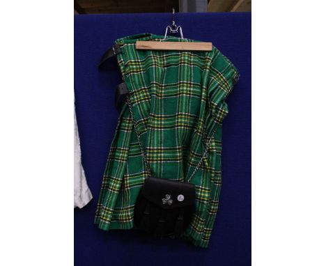 A GREEN TARTAN KILT WITH A SPORRAN
