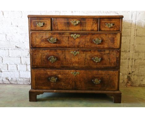 Antique walnut and satinwood strung chest of drawers, the rectangular top with moulded edge, above three short frieze drawers