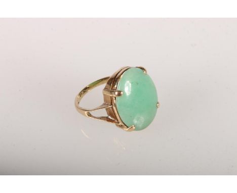 Yellow metal dress ring with jadeite cabochon, size K, 4 g.&nbsp; 