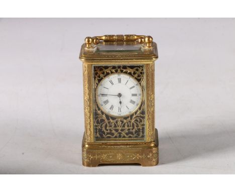 C. 1900 miniature four glass carriage clock with classical decoration and enamel dial with Roman and Arabic numerals, movemen