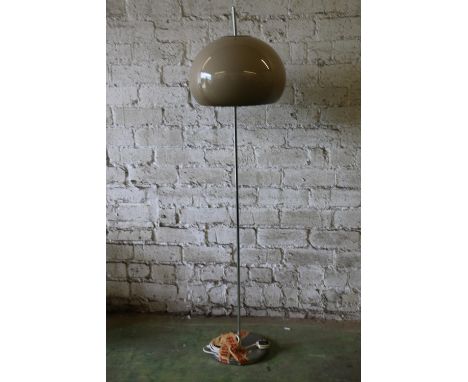 Mid-20th century chromed metal floor lamp with beige circular plastic shade in the manner of Harvey Guzzini. Base chrome appe