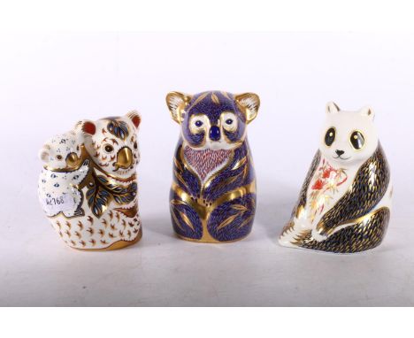 Royal Crown Derby paperweights to include Koala and Baby with gold stopper, Imari pattern and Panda with silver stopper to ba