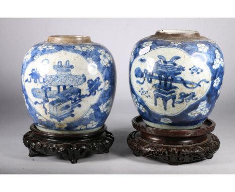 Pair of 19th century Qing Dynasty Chinese Kangxi style ginger jars, the oviform jars decorated with prunus blossom and precio