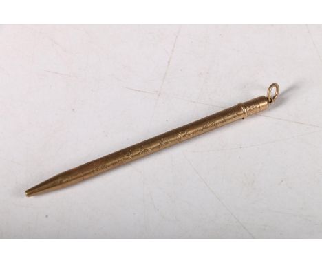 9ct gold pencil with engine turned exterior and inscription, 9cm, 7.2g.&nbsp; 