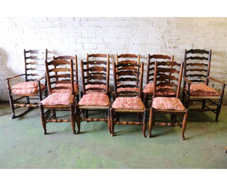 Harlequin set of ten North English oak and elm ladder back dining chairs with rush seats comprising a rocking chair, a carved