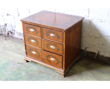 Early 19th century apprentice size satinwood table-top chest, the six square drawers with painted garland decoration and simi