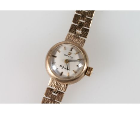 9ct gold Omega lady's manual wind bracelet cocktail watch, 23.6g gross.&nbsp; 