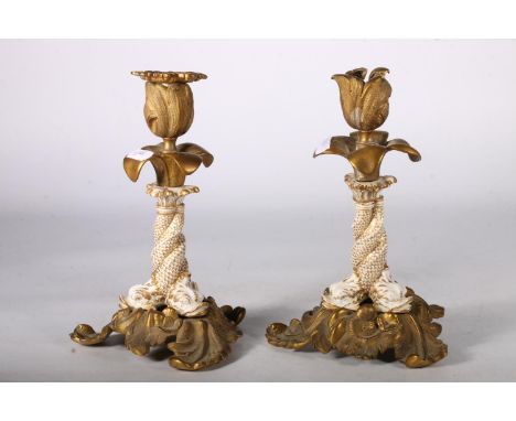 Pair of brass and ceramic flower head candlesticks with Koi fish decorated to the stem, 21cm tall. Broken handle is in bag wi