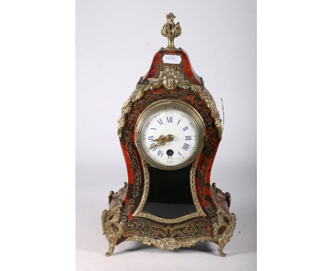 Late 19th Century French Boulle mantel clock with circular enamel dial and Roman numerals, the cartouche case with ormolu mou