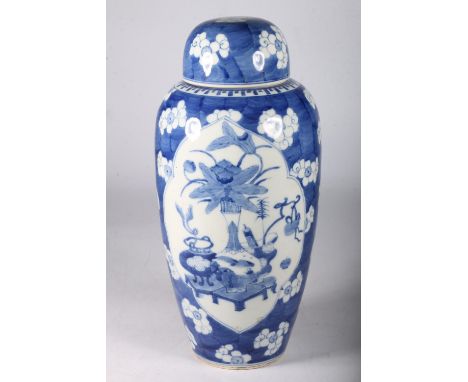 19th century Qing Dynasty Chinese Kangxi style vase with cover, The oviform vase with central panel of precious objects withi