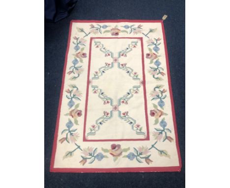 Tapestry with cream field and floral decoration, 176 x 120cm. 