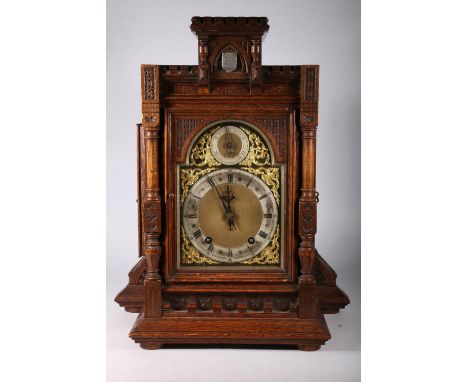 Late 19th century continental oak bracket clock by Winterholder & Hoffmeier, The gothic style clock with viewing door enclosi