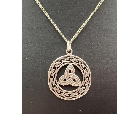 A silver Celtic design pendant on a 20" curb chain with lobster style clasp. Back of pendant, chain fixings and clasp all mar
