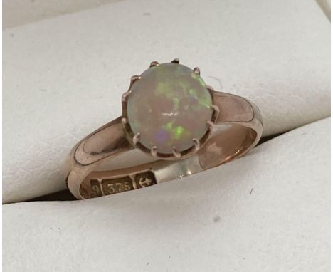 A child's vintage Opal set 9ct gold ring. Fully hallmarked inside band, with Birmingham assay mark. Ring size G.  Approx. 1.4