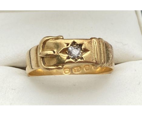 A vintage 18ct gold buckle design ring set with a single round cut 0.07ct diamond. Fully hallmarked inside of band. Ring size
