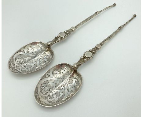 A pair of Victorian Silver Mappin &amp; Webb highly decorative serving spoons. Hallmarked to reverse of stems, London 1898. L