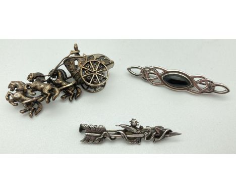 3 vintage silver and white metal brooches. An arrow sweetheart brooch with baby dragon detail, a Celtic design brooch set wit