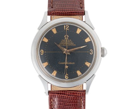 A RARE GENTLEMAN'S SIZE STAINLESS STEEL OMEGA CONSTELLATION WRIST WATCH CIRCA 1950, REF. 2652-1 WITH BLACK "HONEYCOMB" DIALMo