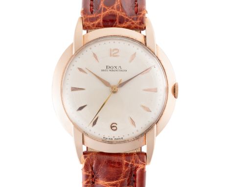 A GENTLEMAN'S LARGE SIZE 14K SOLID ROSE GOLD DOXA WRIST WATCH CIRCA 1950, WITH CLAW LUGSMovement: Manual wind, ETA cal. 1147,
