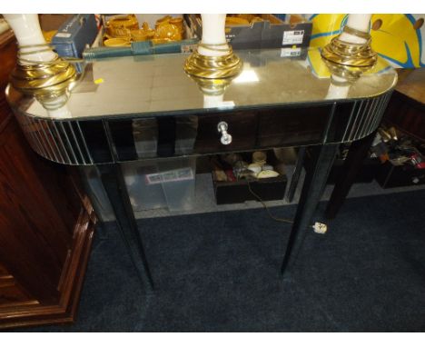 A MODERN MIRRORED CONSOLE TABLE