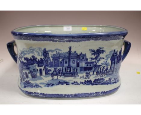 A VICTORIAN BLUE AND WHITE TWIN HANDLED CERAMIC FOOT BATH 