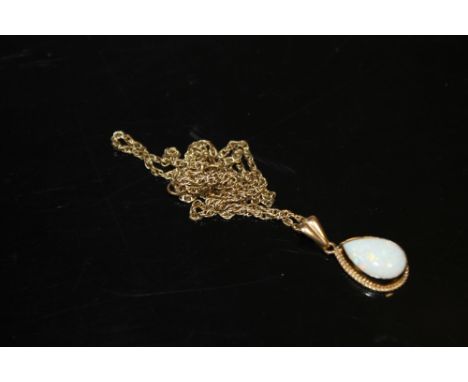 A 9CT GOLD OPAL SET TEARDROP PENDANT ON 9CT GOLD CHAIN