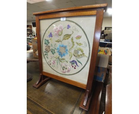 AN EMBROIDERED FIRE SCREEN