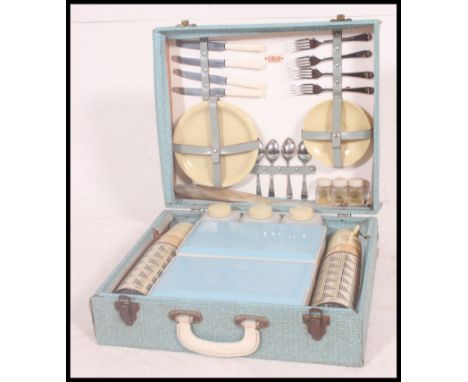 A 1960's baby blue cased four persons  Picnic set by Sirram, being complete with all the original fixtures, containing two Fl