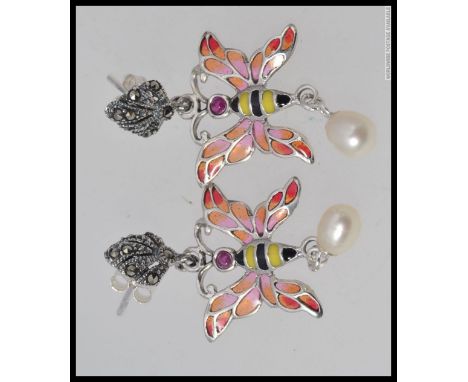 A pair of silver white metal 925 earrings in the form of a fairy, with freshwater pearls and enamel set. 4 grams
