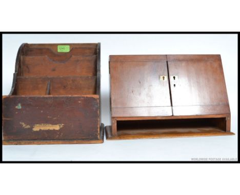 An Industrial oak desk top stationary cabinet with sectioned interior together with a chemists mahogany test tube vial desk t