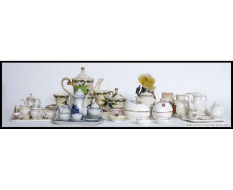 A collection of miniature Staffordshire ceramic tea services to include cups, saucers, teapot etc