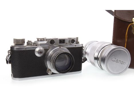 LEICA DRP ERNST LEITZ WETZLAR CAMERA, no. 328534, along with a Canon lens 135mm No. 51590, each in a leather carry pouch (2)
